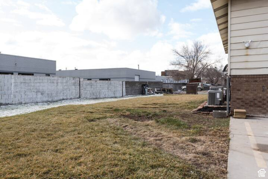 View of yard with central AC unit