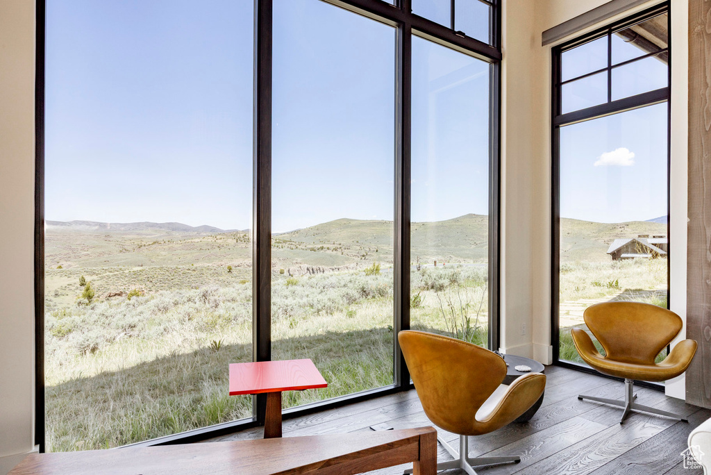 Sunroom / solarium with a mountain view