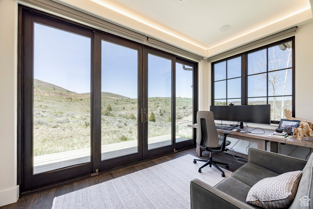 Home office featuring wood finished floors and a mountain view