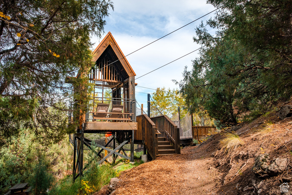 View of home's exterior featuring stairs and a deck