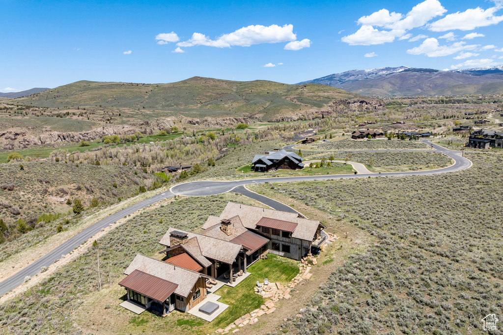View of subject property featuring a mountainous background