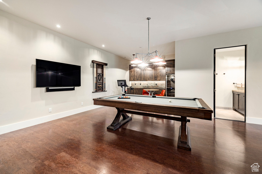 Game room with wood finished floors, baseboards, billiards table, and recessed lighting