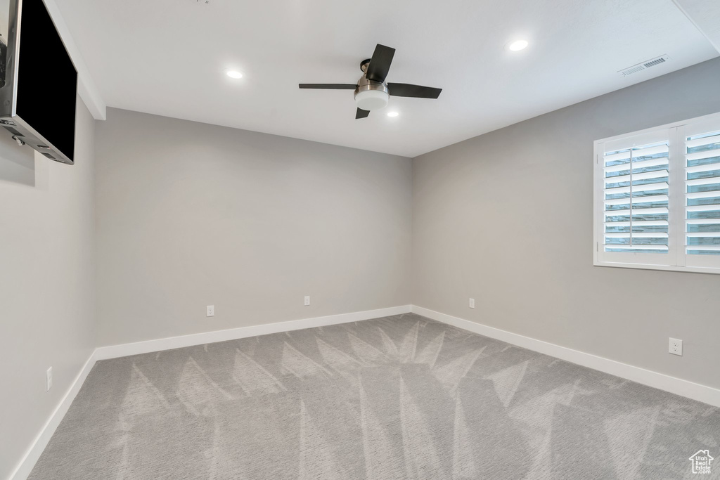 Spare room with ceiling fan, carpet flooring, baseboards, and recessed lighting