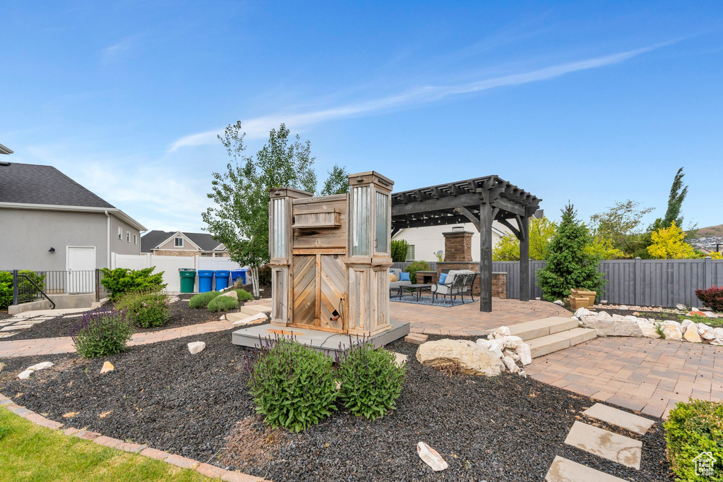 View of patio / terrace with a fenced backyard and a pergola