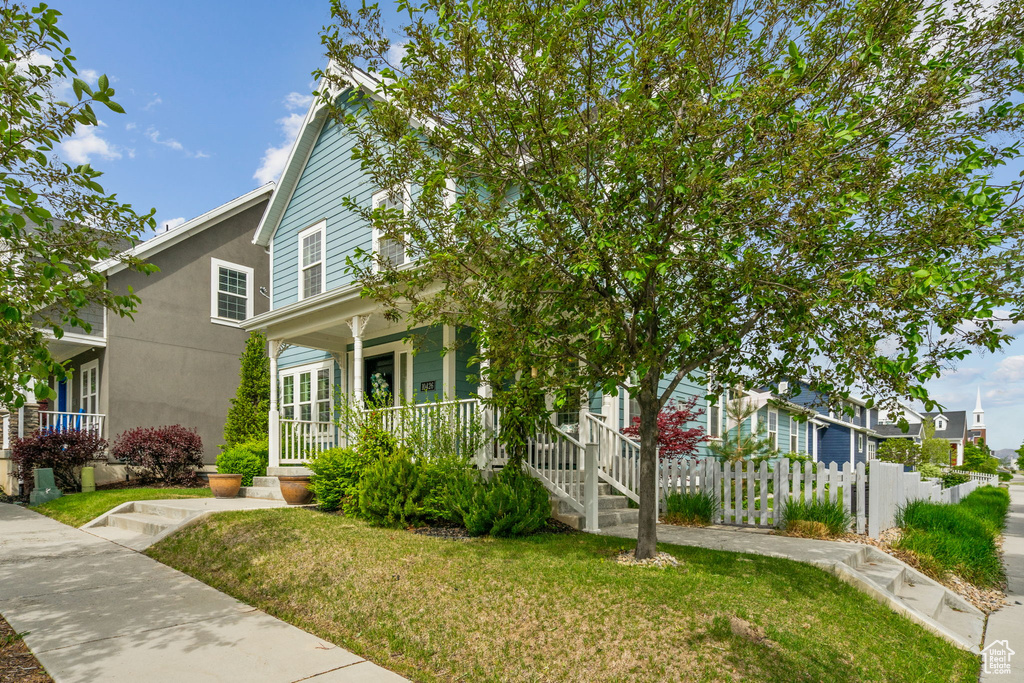 View of front of property featuring a porch and stucco siding