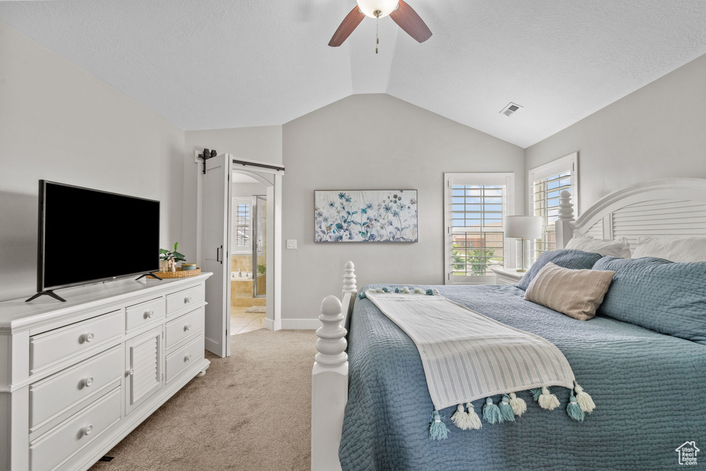 Bedroom with light carpet, lofted ceiling, a ceiling fan, and baseboards
