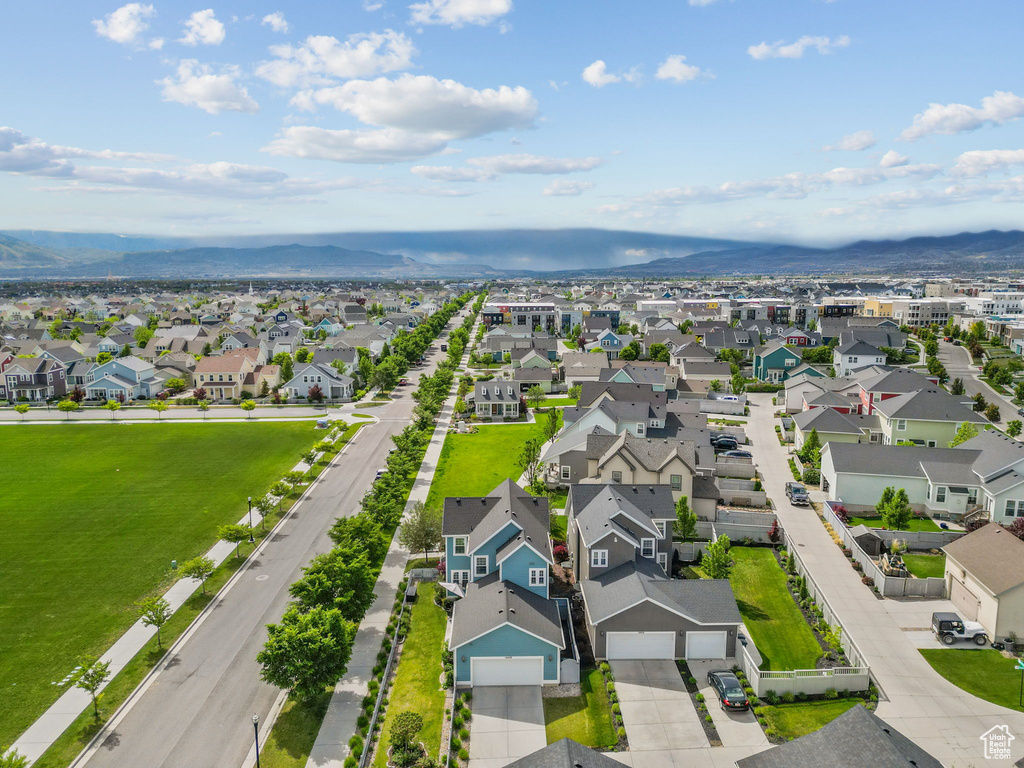 Aerial view of residential area featuring mountains