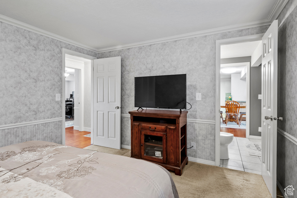 Bedroom featuring crown molding