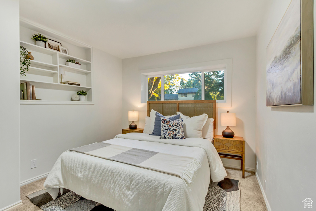 Carpeted bedroom with baseboards