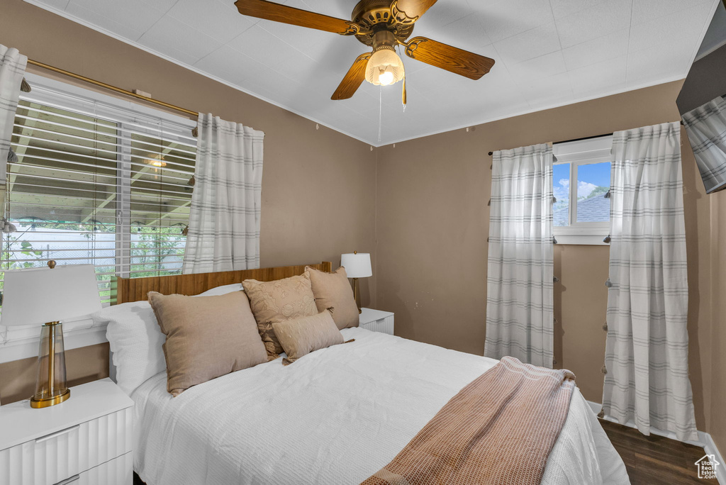 Bedroom with wood finished floors and ceiling fan