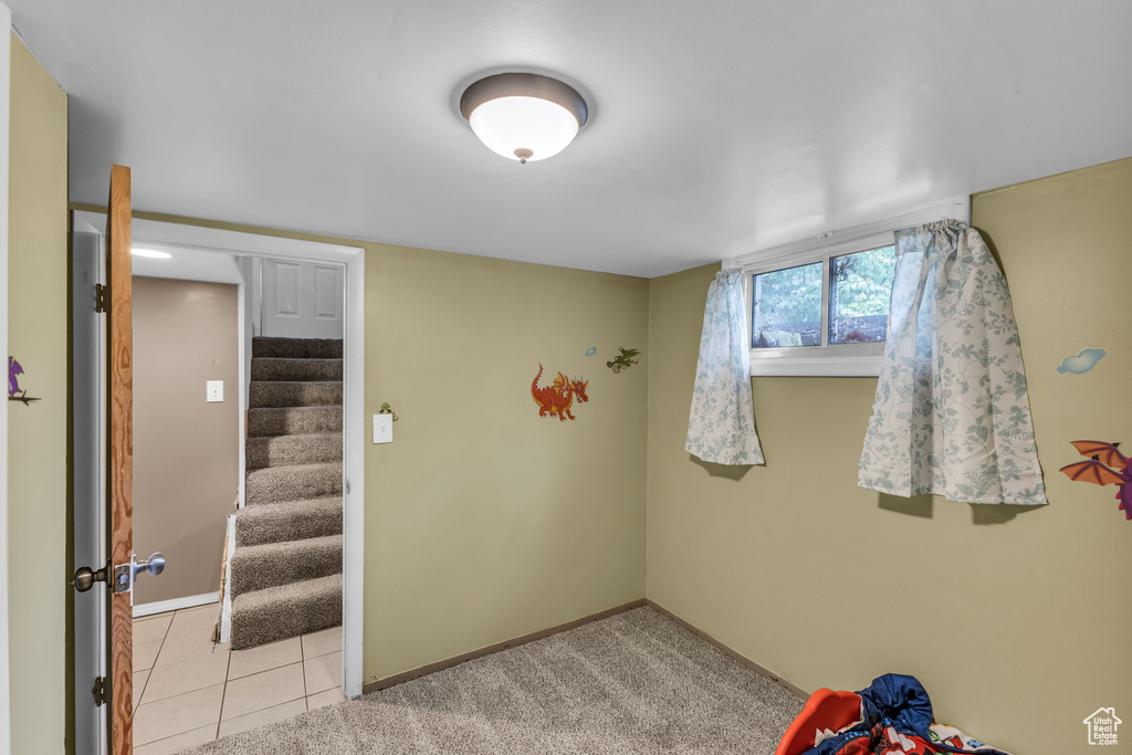 Playroom with baseboards and light tile patterned floors