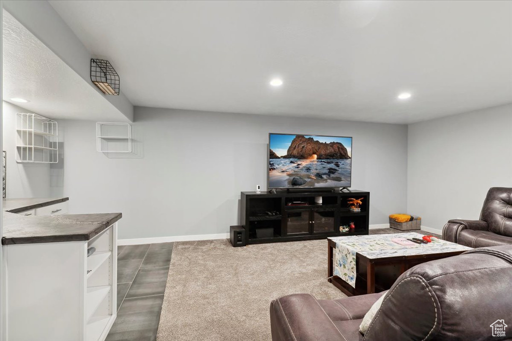 Living room with baseboards and recessed lighting