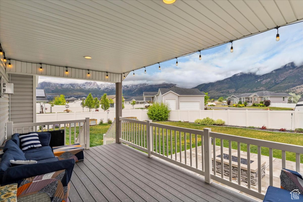 Deck with a mountain view and a residential view