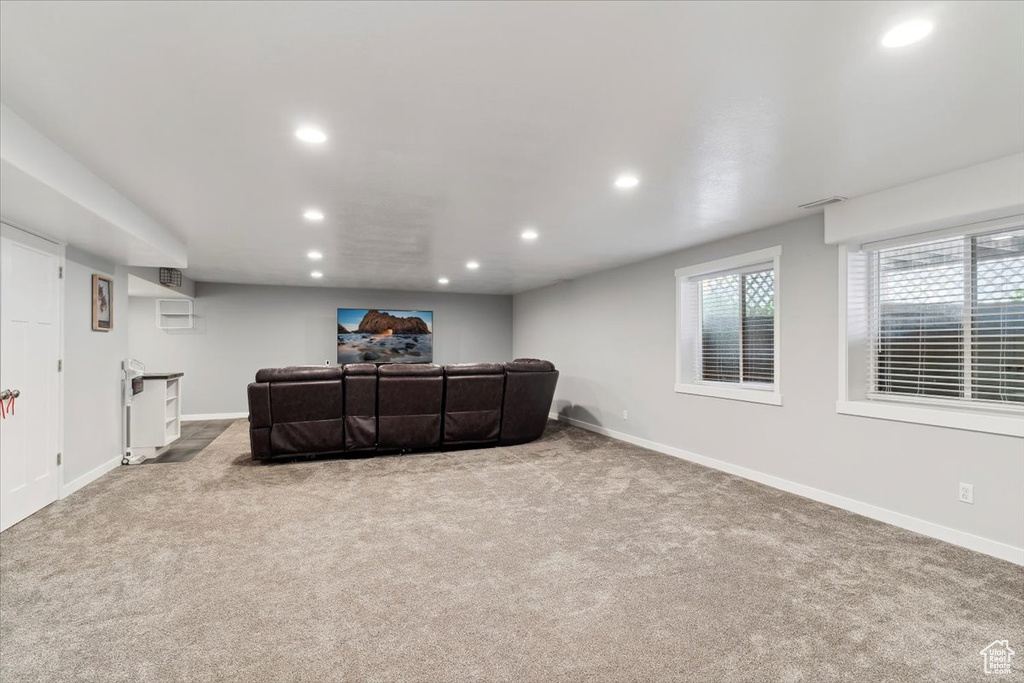 Living area featuring recessed lighting, carpet flooring, and baseboards