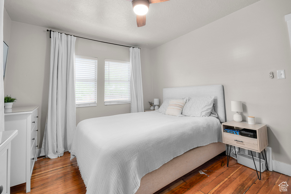 Bedroom featuring wood-type flooring and ceiling fan
