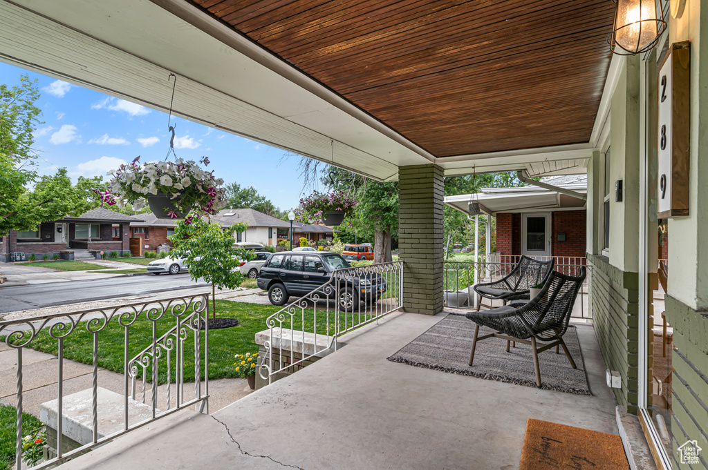 View of patio with a porch and a residential view
