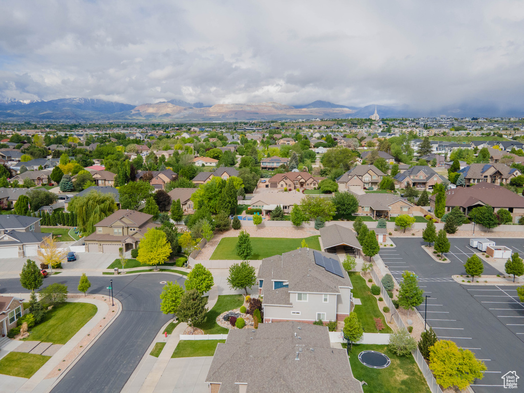 Aerial view of residential area featuring a mountain backdrop