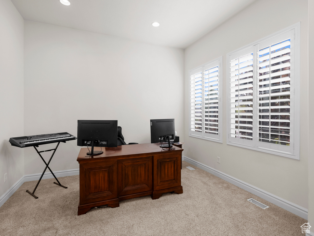Home office featuring light colored carpet, recessed lighting, and baseboards