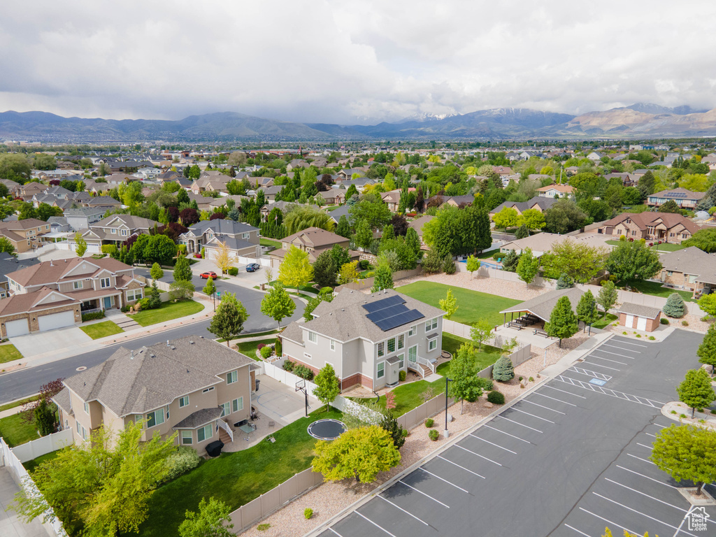 Aerial perspective of suburban area with a mountain backdrop
