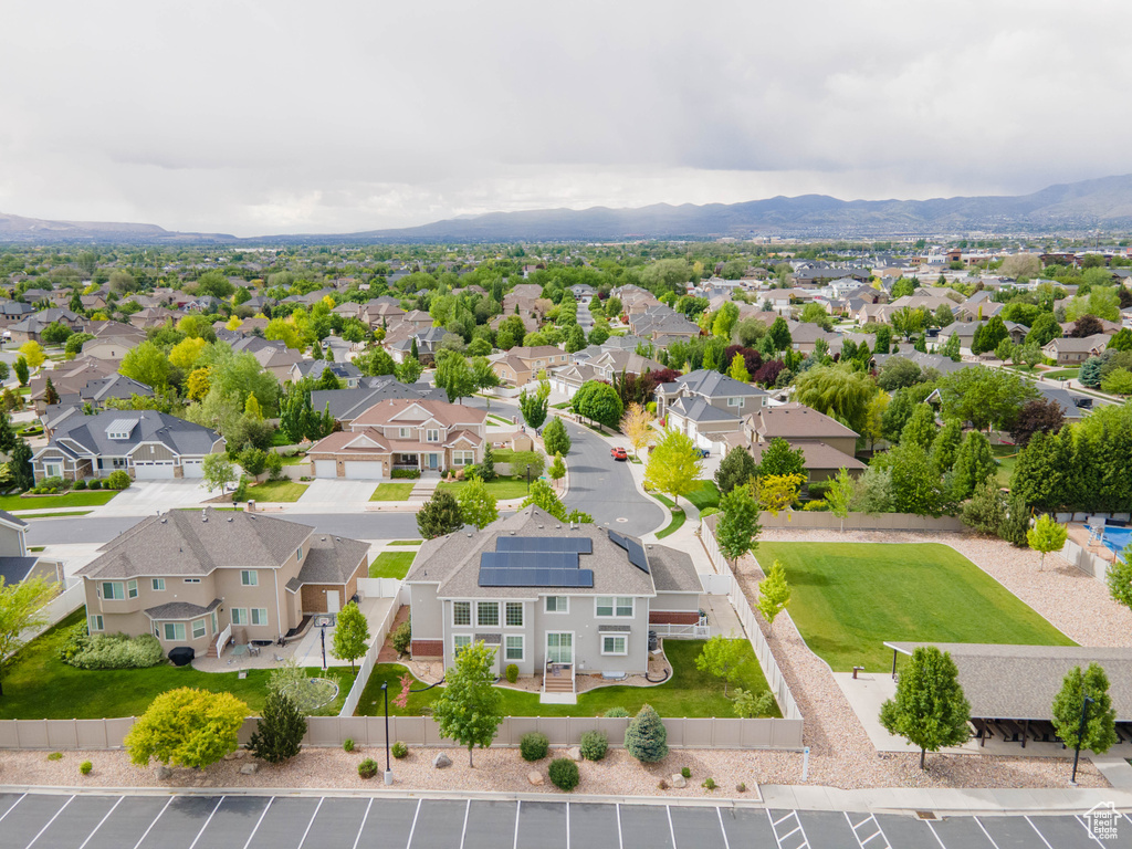 Aerial view of residential area featuring a mountainous background