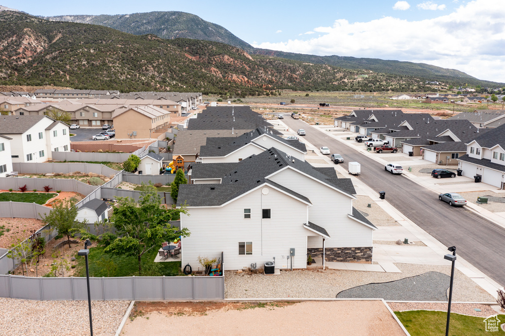 Aerial view of residential area featuring a mountain backdrop