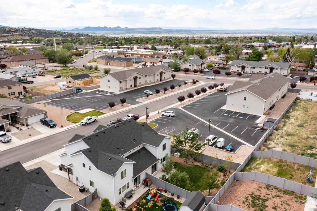Aerial perspective of suburban area with a mountainous background
