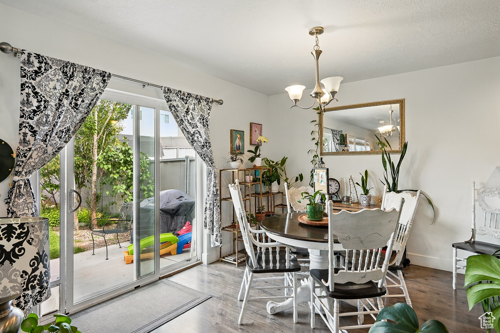 Dining room featuring a chandelier and wood finished floors