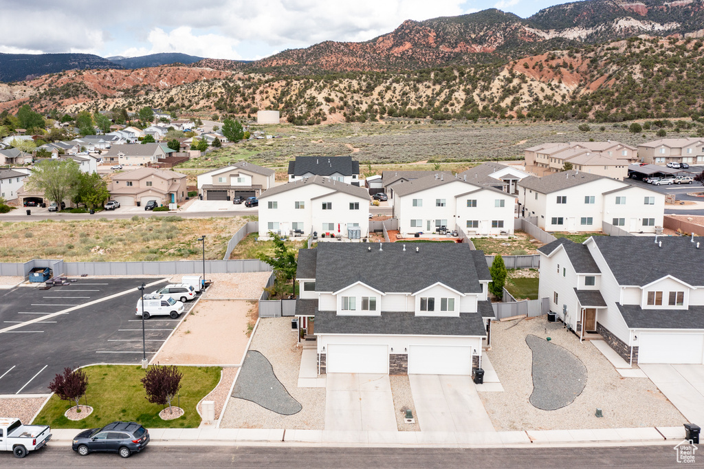Aerial perspective of suburban area with a mountain backdrop