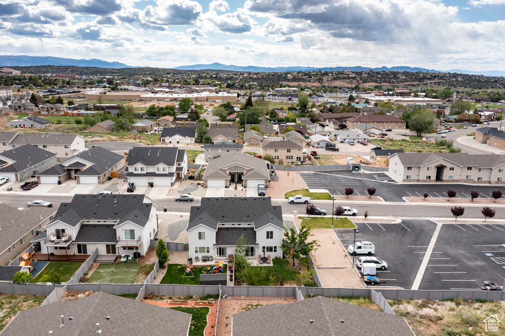 Aerial view of residential area featuring a mountainous background