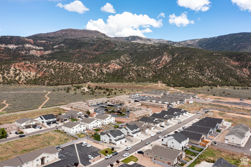 View of mountain backdrop featuring nearby suburban area