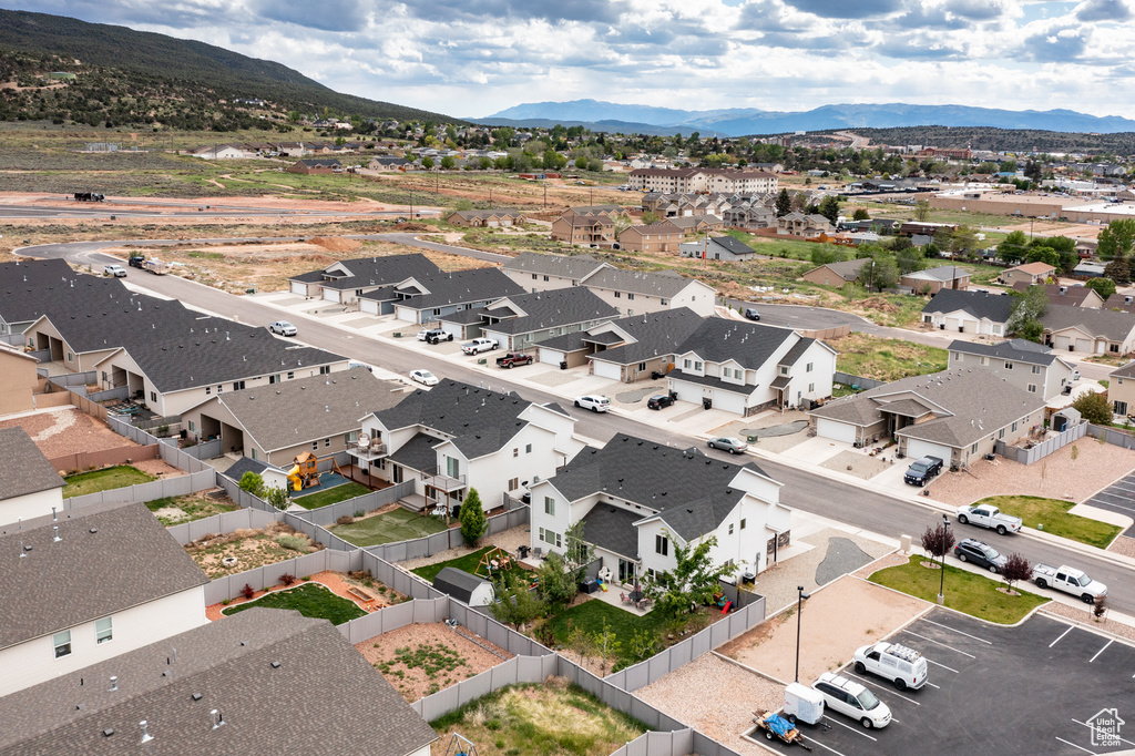Aerial perspective of suburban area featuring a mountain backdrop
