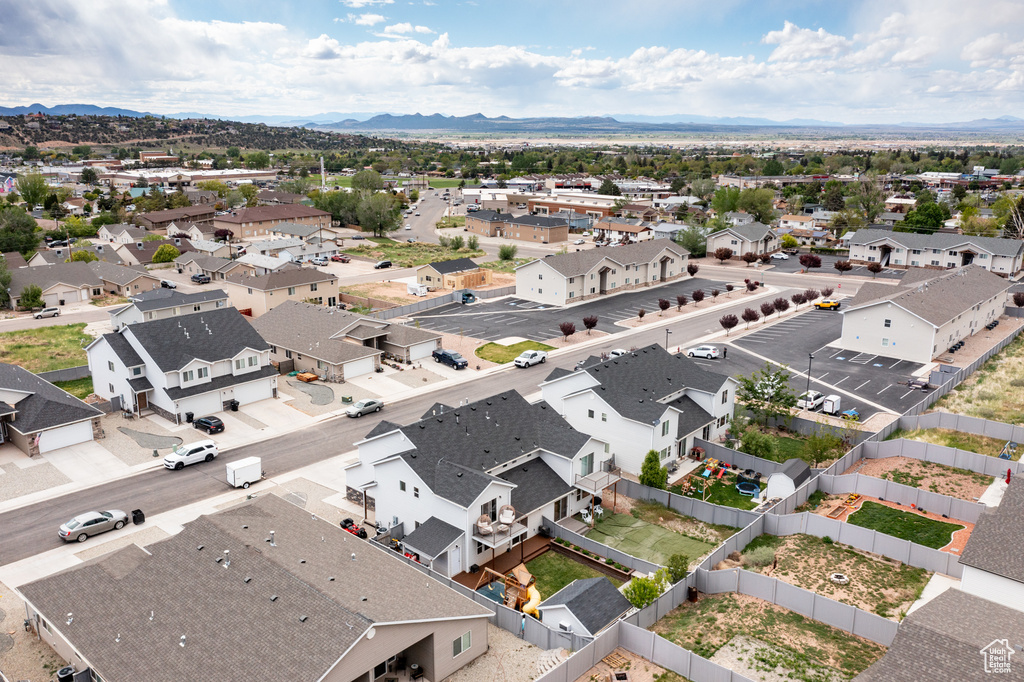 Aerial view of residential area with a mountainous background