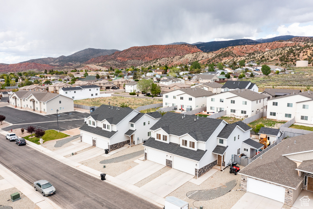 Aerial perspective of suburban area with a mountain backdrop