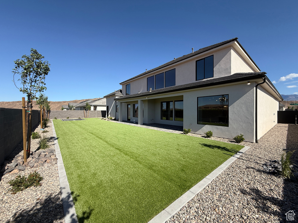 Back of property with stucco siding