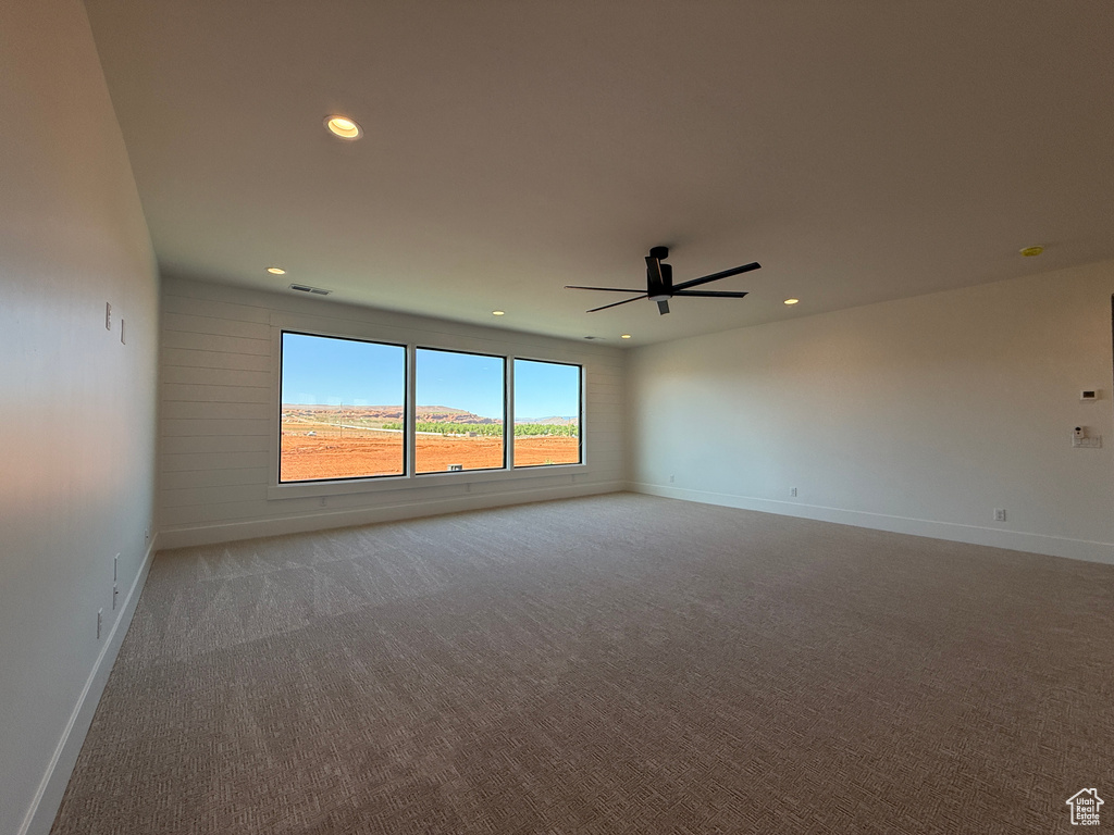 Unfurnished room with carpet flooring, recessed lighting, a ceiling fan, and baseboards