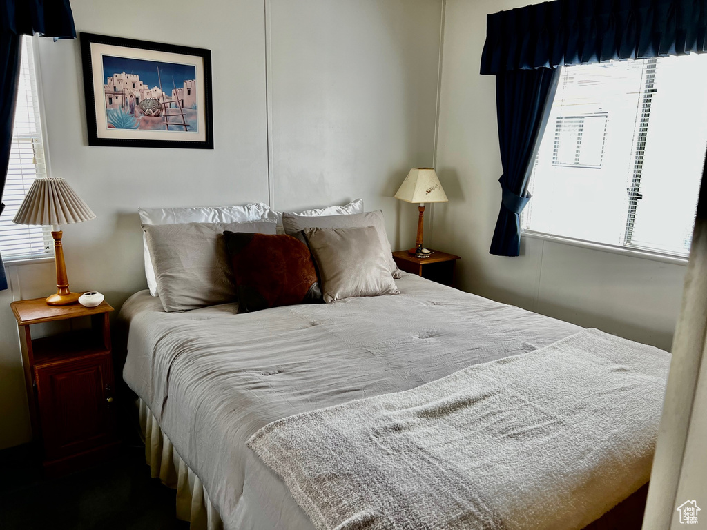 Bedroom featuring multiple windows