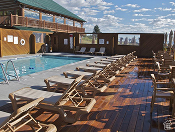 Community pool featuring a deck