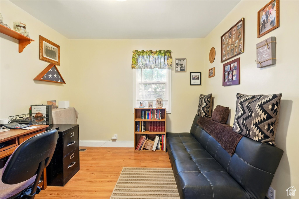 Home office featuring light wood-style floors and baseboards