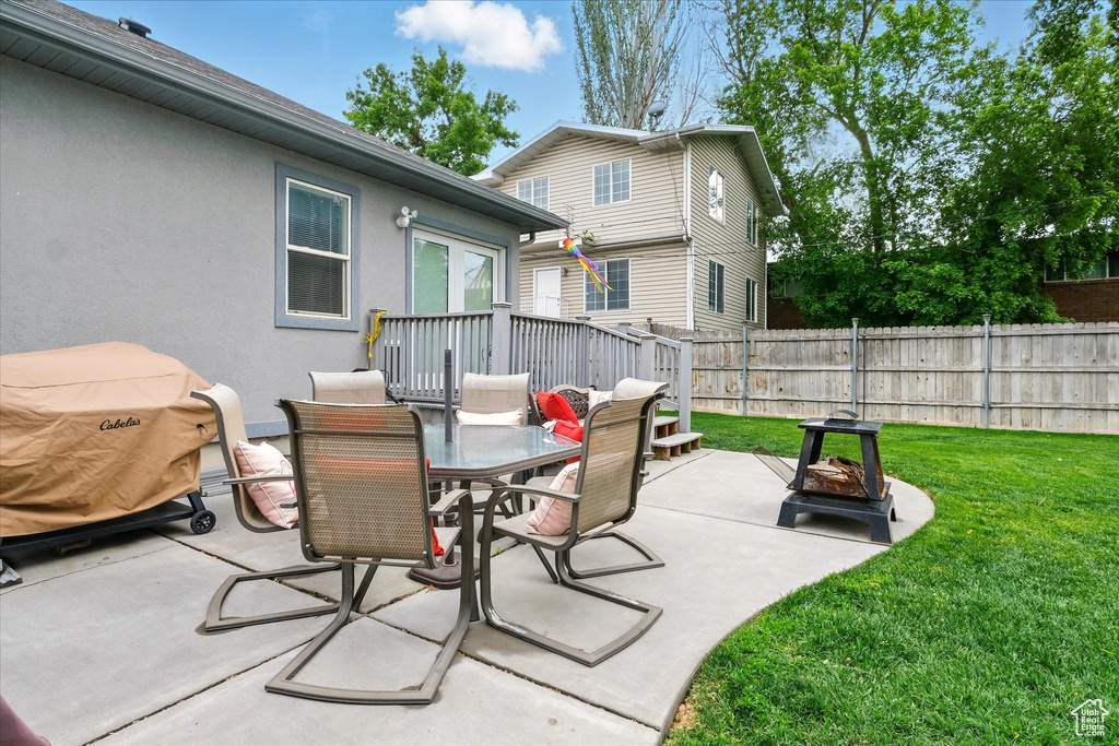 View of patio featuring an outdoor fire pit