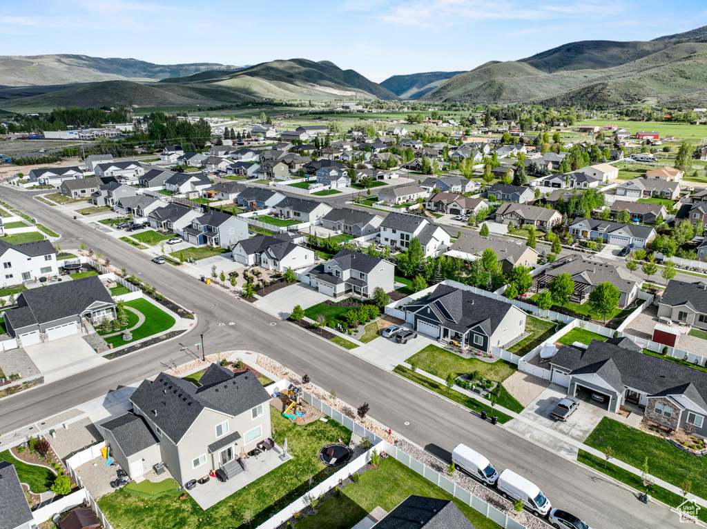 Aerial perspective of suburban area with a mountain backdrop