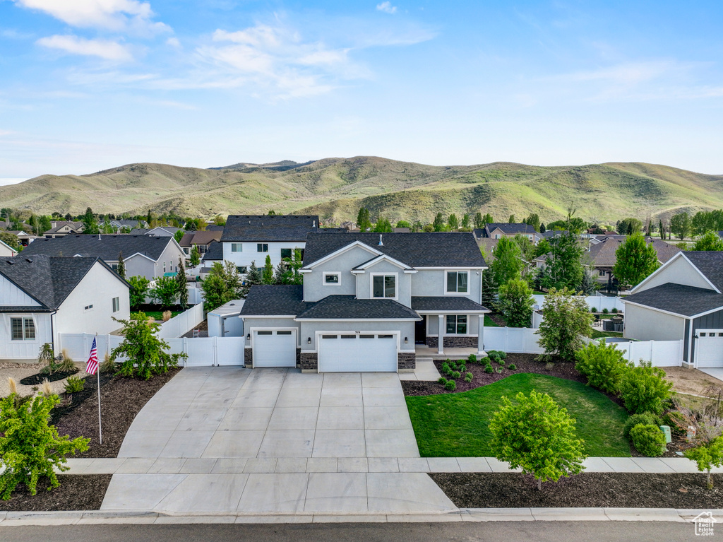 Aerial perspective of suburban area with a mountain backdrop