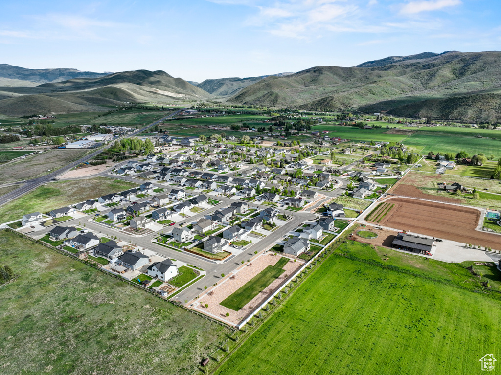 Aerial view of property\'s location featuring a mountain backdrop