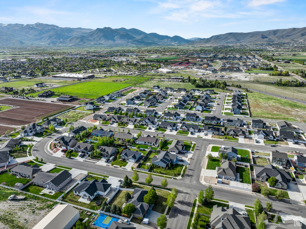 Aerial overview of property\'s location featuring nearby suburban area and a mountain backdrop