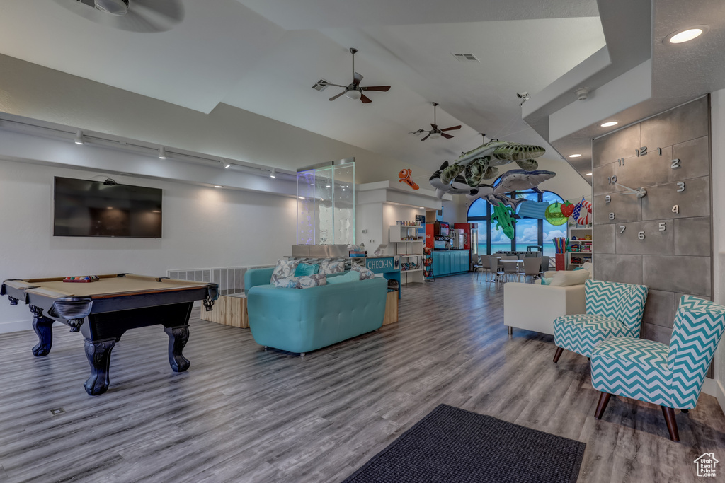 Game room with a ceiling fan, wood finished floors, billiards table, recessed lighting, and high vaulted ceiling