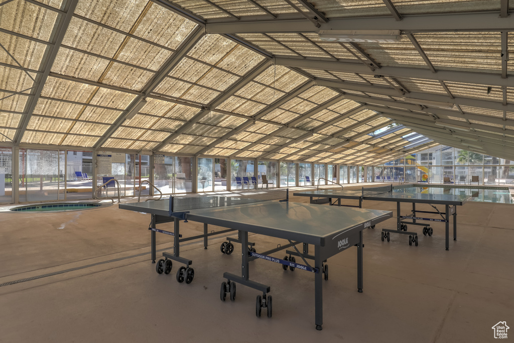 Rec room with vaulted ceiling and healthy amount of natural light