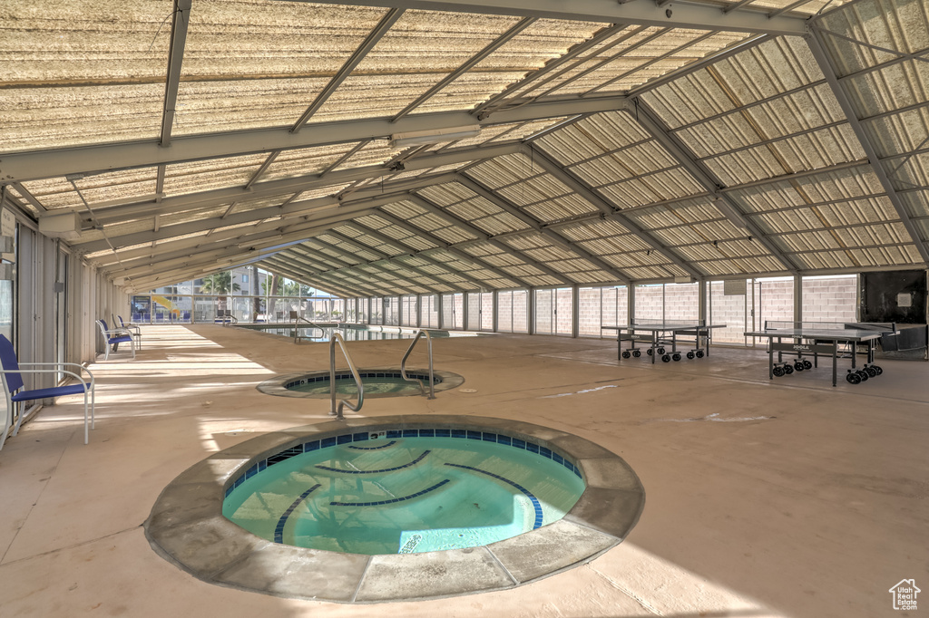 View of pool with an in-ground hot tub