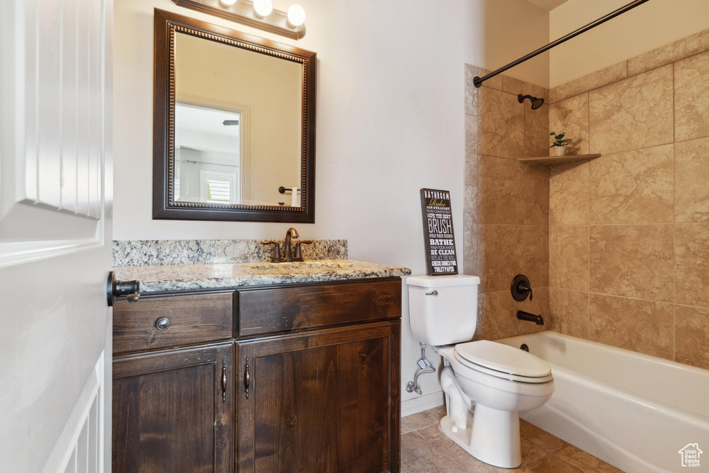 Full bathroom featuring vanity, toilet, shower / washtub combination, and tile patterned floors
