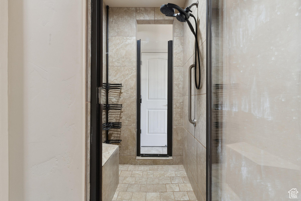 Bathroom featuring a shower stall