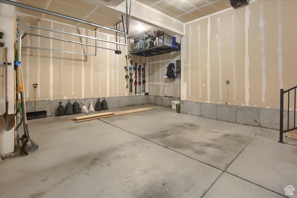 Garage featuring a garage door opener