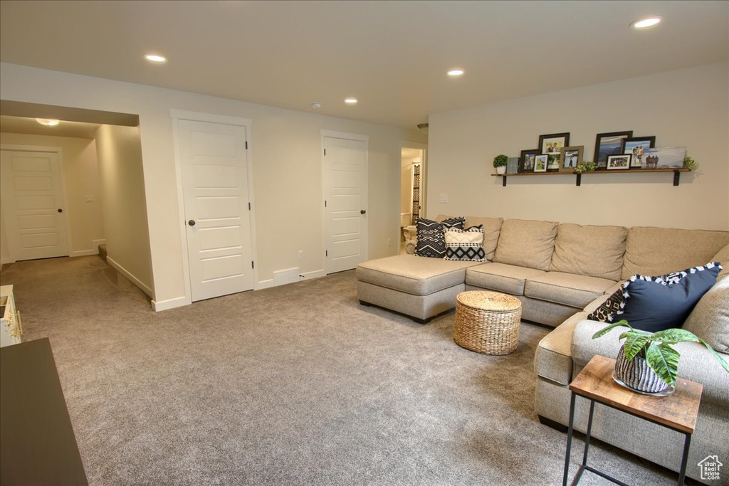 Living room featuring recessed lighting, carpet flooring, and baseboards